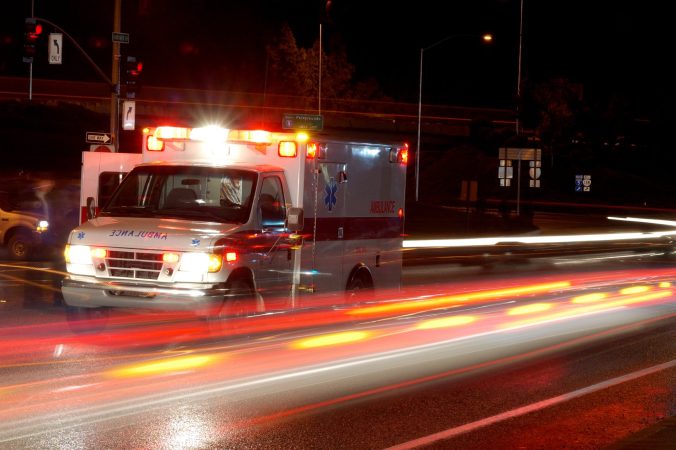Ambulance and emergency equipment at a motor vehicle accident at night